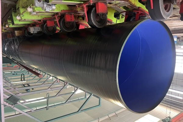What are the key considerations for the pretreatment and welding of plastic-coated steel pipes