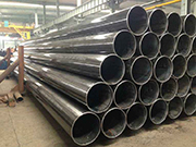 What is the manufacturing background and key details of Q235 straight seam welded steel pipe